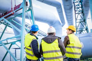 Engineers discussing safety, chemical plant